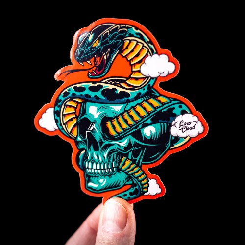 Orange vinyl sticker of a snake in a skull held by a hand