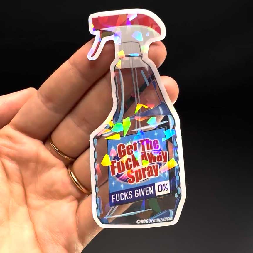 A hand holding a clear sticker with cracked ice add on with a spray bottle on it