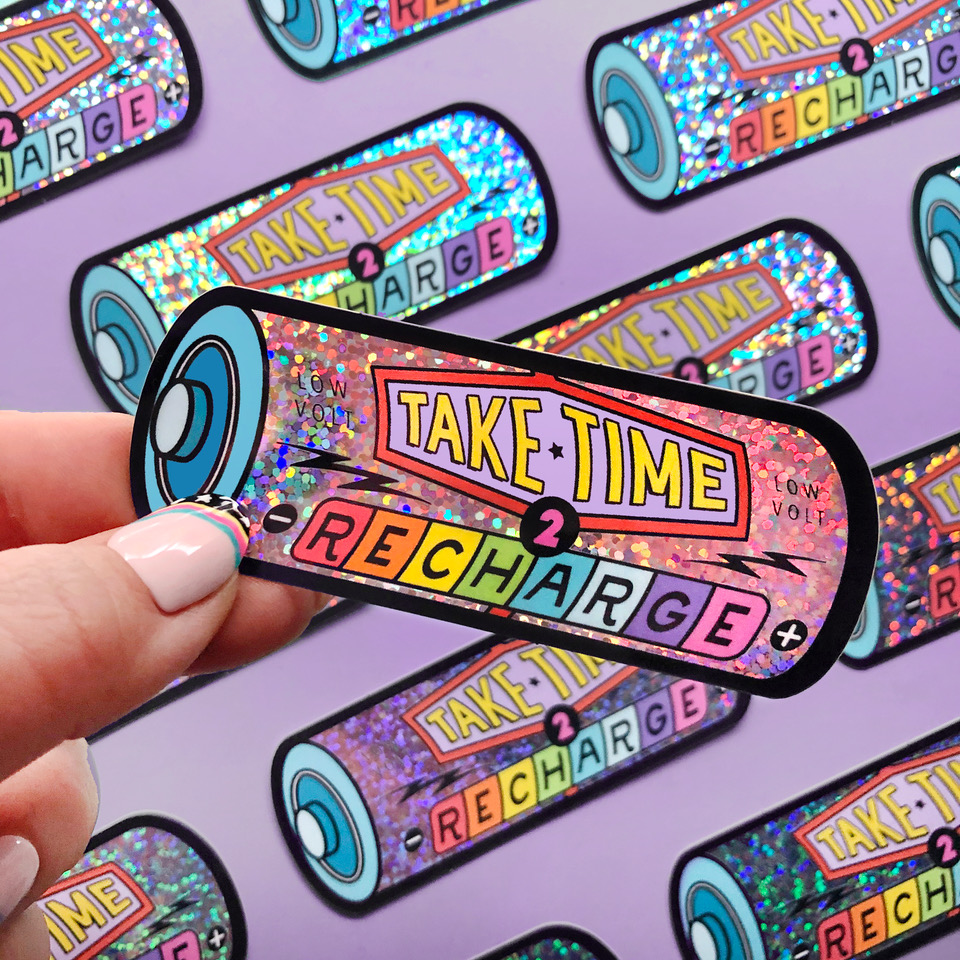 Glitter die cut sticker in the shape of a battery with quote "Take time to recharge".